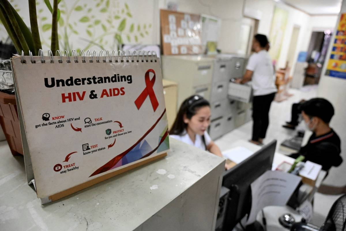 In this photo taken on May 10, 2023, show a patient waiting in line at a social hygiene clinic in Quezon City, Metro Manila. The spread of HIV has drastically slowed down in many parts of the world since the epidemic’s peak in 1995. But in the Philippines, infections have been rising steeply for over a decade – this year, around 50 people are diagnosed with HIV daily, compared to only four a day in 2010. (Photo by JAM STA ROSA / AFP) / TO GO WITH STORY: Philippines-health-virus-HIV, by Lucille SODIPE