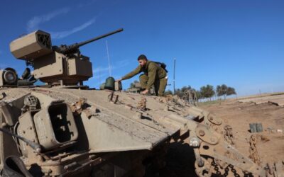 ARMISTICE EXPIRING An Israeli soldier climbs aboard an armed APC (armored personnel carrier) in southern Israel near the border with the Gaza Strip on Thursday, Nov. 30, 2023, as a truce between Israel and Hamas enters its seventh day. A truce between Israel and Hamas was extended on November 30 just before it was due to expire, the two sides announced, with mediator Qatar reporting it would continue for one day under the same conditions that saw hostages released in exchange for prisoners. AFP PHOTO