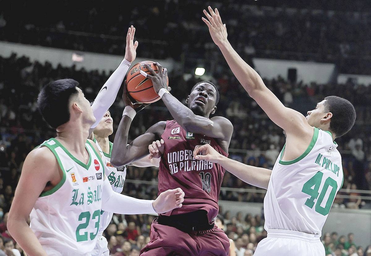 UP’s Malick Diouf rebounds against La Salle players during the UAAP Season 86 basketball finals Game 2 at the Smart Araneta Coliseum on Sunday, Dec. 3, 2023. PHOTO BY RIO DELUVIO