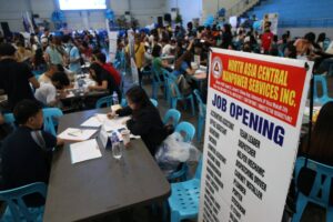 Malabon Mayor Jennie Sandoval and PBGen. Rizalito Gapas, Northern Police District (NPD) director, lead the Mega Job Fair at the city's sports complex on Wednesday, Dec. 6, 2023. PHOTO BY RENE H. DILAN