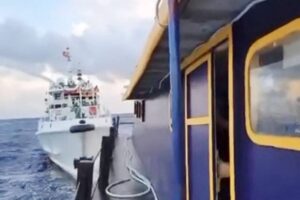 AHOY! This handout photo taken and released on Dec. 10, 2023, by the Philippine Coast Guard (PCG) shows a China Coast Guard vessel (right) using water cannon against the M/L Kalayaan chartered supply boat during a mission to deliver provisions at Second Thomas Shoal in disputed waters of the South China Sea (SCS). A Philippine boat was ‘rammed’ by a Chinese coast guard ship during a resupply mission on Sunday, the PCG said, in the latest such confrontation in the disputed SCS. AFP PHOTO
