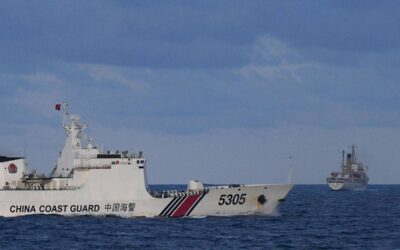 Philippine Government Urged to Consider Ending Chinese Business Operations A Chinese Coast Guard ship sails near a Philippine vessel (R) that was part of a convoy of civilian boats in the disputed South China Sea on December 10, 2023. A convoy of civilian boats planning to deliver provisions to Filipino fishermen and troops in the disputed South China Sea aborted the trip on December 10 after 'constant shadowing' by Chinese vessels, the organiser said. TED ALJIBE / AFP