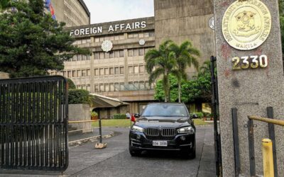 A Chinese diplomatic vehicle leaves the Department of Foreign Affairs in Manila on December 11, 2023. The Philippines said it had summoned China's envoy on December 11 and flagged the possibility of expelling him following the most tense confrontations between the countries' vessels in years at flashpoint reefs in the disputed South China Sea. JAM STA ROSA / AFP