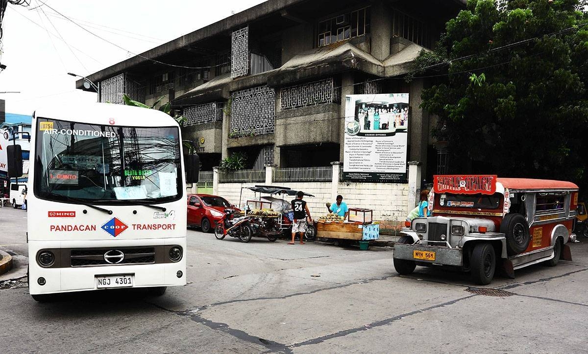 In this file photo A modern public utility vehicle (MPUV) and traditional passenger jeep (PUJ) are seen waiting for passengers at the corner of Leon Guinto Street in Manila. PHOTO BY MIKE ALQUINTO