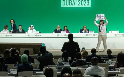 Climate Negotiations Extend Beyond Deadline, Fossil Fuel Phase-Out Compromise Sparks Outrage This image grab taken from AFPTV video footage shows an activist protesting on stage against fossil fuels during an event at the United Nations Climate Conference in Dubai on December 11, 2023. AFP