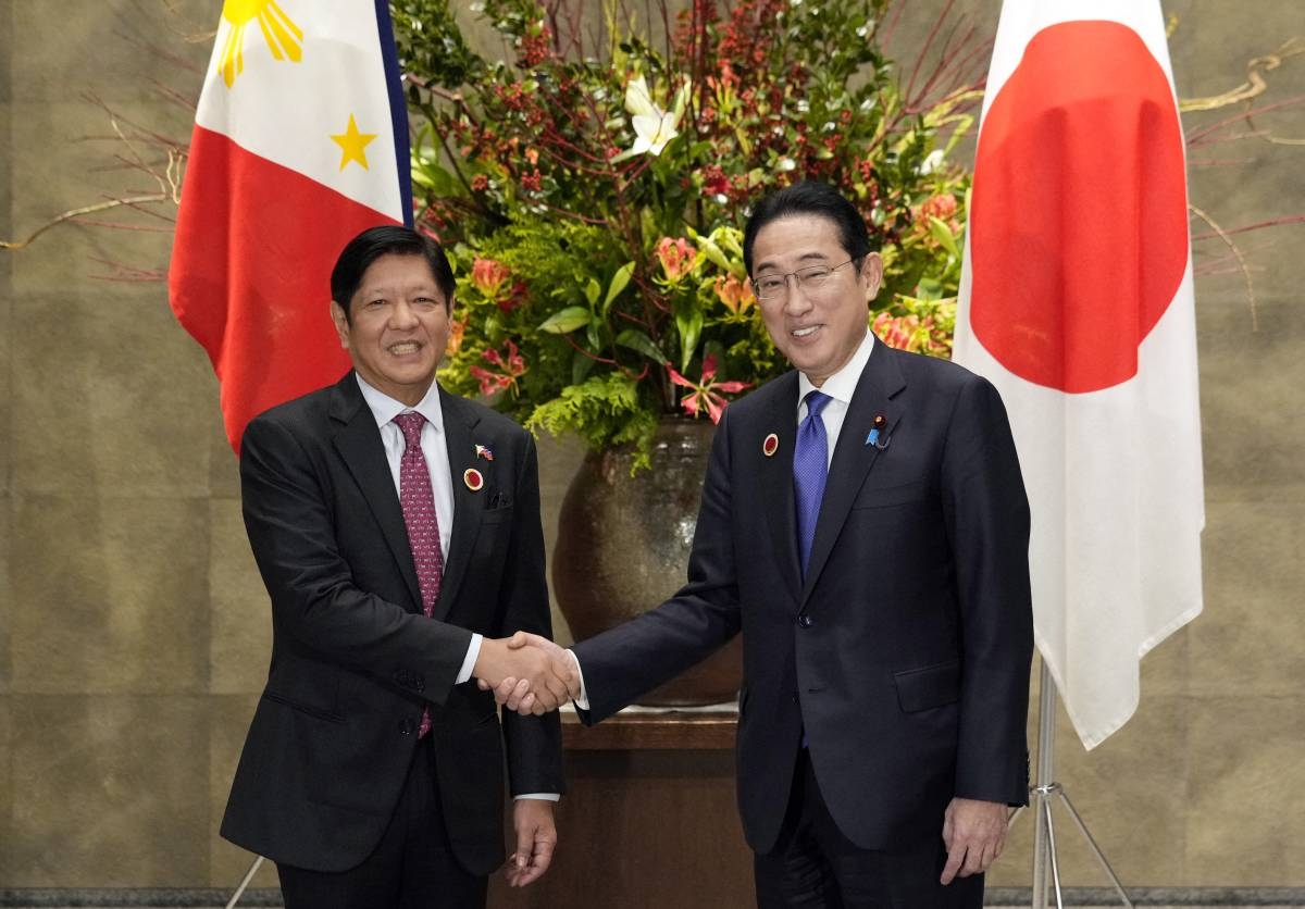 Japan's Prime Minister Fumio Kishida (right) shakes hands with President Ferdinand Marcos Jr. during their bilateral meeting, on the sidelines of the Asean-Japan Summit, at the prime minister's official residence in Tokyo on December 17, 2023. PHOTO BY FRANCK ROBICHON / POOL / AFP
