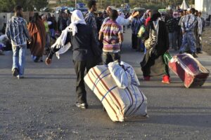 A picture taken on December 10, 2013 shows Ethiopian immigrants returning from Saudi Arabia arriving at Addis Ababa’s Bole International Airport. The number of migrants reaching Saudi Arabia appears to have declined in recent months, several smugglers told AFP, though it is unclear if that is because fewer Ethiopians are trying to cross or because they don't make it.
JENNY VAUGHAN / AFP