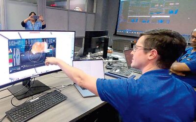 n Members of the DSOC team react to the first high-definition streaming video to be sent via laser by the DSOC transceiver aboard the Psyche spacecraft, nearly 19 million miles from Earth, featuring a cat named Taters, on Dec. 11, 2023 at NASA’s Jet Propulsion Laboratory in Pasadena, California. NASA on Dec. 18, 2023, announced it had used a state-of-the-art laser communication system on a spaceship 19 million miles (31 million kilometers) away from Earth — to send a high-definition cat video. The 15-second meow-vie featuring an orange tabby named Taters is the first to be streamed from deep space, and demonstrates it’s possible to transmit the higher-data-rate communications needed to support complex missions such as sending humans to Mars. (Photo by Handout / NASA/JPL-Caltech / AFP)