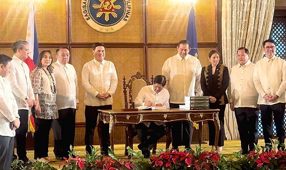 SIGNED President Ferdinand Marcos Jr. signs into law the national budget for 2024. CONTRIBUTED PHOTO