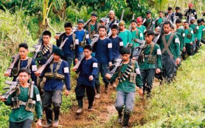 Heavily armed communist guerrillas of the New People's Army (NPA) parade in a village in Lianga town in the rebel's mountain stronghold in southern Mindanao island 06 January 2004. Communist guerrilla leaders earlier announced that they will charge politicians "permit to campaign" fees in areas where the NPA are active. The militlary said the rebels charge about a million pesos (18,080 USD) for each senatorial candidate with smaller sum s for local candidates during the 2001 elections.  AFP PHOTO    STR
File:080104_npa01
Photos today3/news/1-09