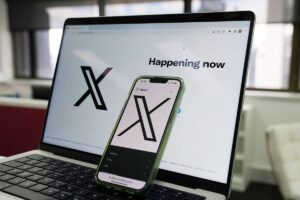 PUNISHED The opening page of X is displayed on a computer and phone in Sydney on Monday, Oct. 16, 2023. Formerly known as Twitter, X was fined $385,000 by ESafety, Australia’s online safety watchdog, for failing to explain how it tackles child sexual exploitation on its social media platform. AP PHOTO