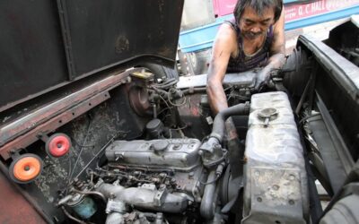 Warlito Clarito, 64, conducts maintenance work on a cooperative-owned passenger jeepney he drives on Wednesday, Dec. 27, 2023. When asked what he will do on December 31, the deadline for mandatory franchise consolidation that could hinder traditional jeepney drivers and operators from continuing their operations, Clarito said that his fellow drivers and operators should collectively stand against the impending jeepney phaseout as this is their only source of livelihood. PHOTO BY MIKE DE JUAN