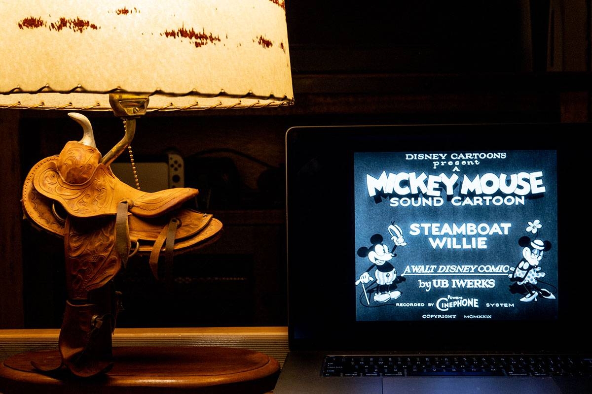 In a photo illustration, an episode of Disney's Steamboat Willie that was the debut of Mickey Mouse is seen on a laptop on January 02, 2024 in Austin, Texas. As of New Year's Day, the copyright for the earliest Mickey Mouse iteration 'Steamboat Willie' has expired, entering the public domain. The expiration of 'Steamboat Willie' does not affect more modern versions of the character. (Photo illustration by Brandon Bell/Getty Images)