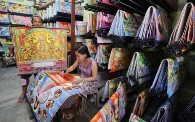 Recycling Calendars: A Quirky Trend from 1996 to 2024 A customer chooses a calendar design at a printing shop along Commonwealth Avenue in Quezon City on Wednesday, Dec. 27, 2023. PHOTO BY MIKE DE JUAN