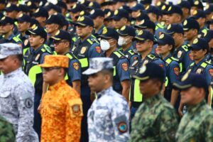 Members of the Philippine National Police, Armed Forces of the Philippines, Philippine Coast Guard, Bureau of Fire Protection and Hijos Del Nazareno are blessed by Rev. Fr. Rufino Sescon Jr., rector and parish priest of the Minor Basilica and National Shrine of the Black Nazarene, during a send-off ceremony for the Feast of the Black Nazarene 2024 at the Quirino Grandstand in Manila, on January 6, 2024. PHOTO BY MIKE ALQUINTO