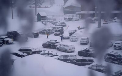 People through the parking area of the Alpine Base Area at Palisades Tahoe during a winter storm Friday, Feb. 24, 2023, in Alpine Meadows, California. AP PHOTO