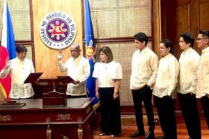 HE’S IN Businessman Eduardo Aliño takes his oath before President Marcos Jr. on Friday, Jan. 12, 2024. With him are his wife Stella and children Paolo Eduardo, Angelo Eduardo, Franco Eduardo and Carlo Eduardo. CONTRIBUTED PHOTO