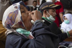 A villager undergoes checks at a village clinic after Mount Marapi erupted spewing ash and causing respiratory problems to people, at Sungai Pua village in Agam, West Sumatra on January 14, 2024. AFP PHOTO