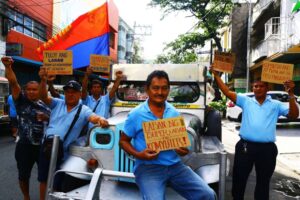 Jeepney drivers rally in Manila. PHOTO BY MIKE ALQUINTO