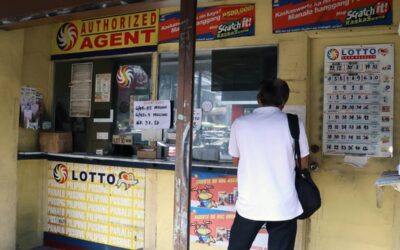 Lotto teller Marsha Anives shows the newly installed FLX lotto machine at an outlet in Project 4, Quezon City on Thursday, September 28, 2023. PHOTOS BY MIKE DE JUAN