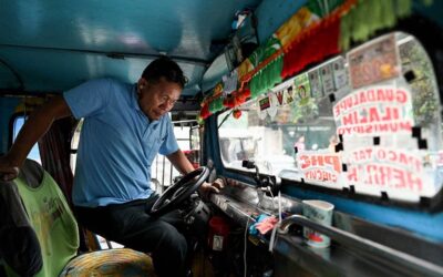 DoLE’s Assistance for Displaced Jeepney Drivers This photo taken on January 15, 2024 shows a man gets in the driver's seat of his jeepney at a terminal in Manila. Philippine jeepney drivers staged a noisy protest in the capital Manila on January 16, 2024 over the government's plan to phase out the smoke-belching vehicles nationwide and replace them with modern mini-buses. JAM STA ROSA / AFP