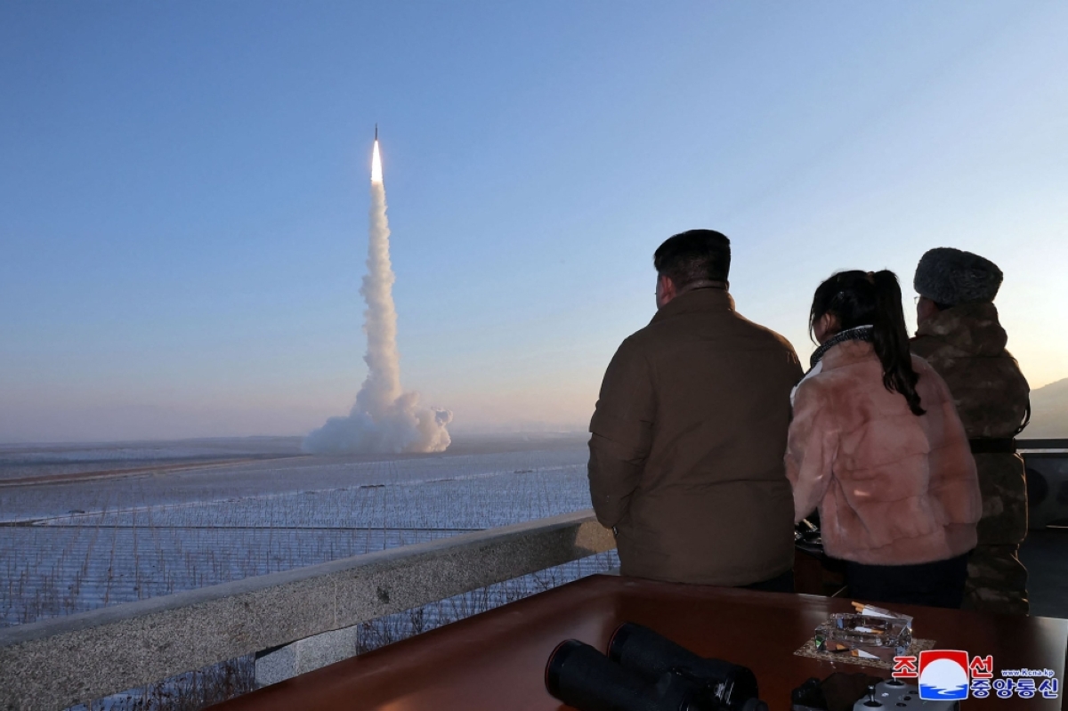 FROM THE SEA This undated picture, released by North Korea’s official Korean Central News Agency (KCNA) on Dec. 19, 2023, shows North Korean leader Kim Jong Un (left) and his daughter watching the test launch of a Hwasongpho-18 intercontinental ballistic missile (ICBM) at an undisclosed location in North Korea. North Korea said on Friday, Jan. 19, 2024, that it had tested an ‘underwater nuclear weapon system’ in response to joint naval exercises by Washington, Seoul and Tokyo that involved a US nuclear-powered aircraft carrier. AFP PHOTO/KCNA VIA KNS