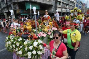 Devotees of the Sto. Nino hold a procession in Tondo, Manila on Saturday, Jan. 20, 2024, a day before the actual feast. The religious event is celebrated every third Sunday of January to commemorate the birth of Catholicism in the country more than 500 years ago. PHOTOS BY RENE H. DILAN