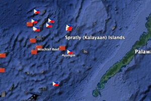 Chinese- and Philippine-occupied features in the Spratlys (Kalayaan Island Group) marked by their respective flags. Drawing by author using Google Earth Pro