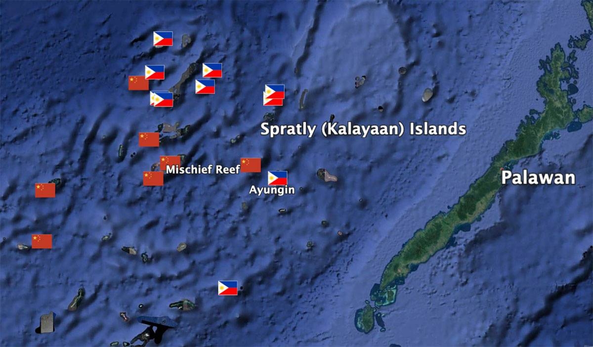 Chinese- and Philippine-occupied features in the Spratlys (Kalayaan Island Group) marked by their respective flags. Drawing by author using Google Earth Pro