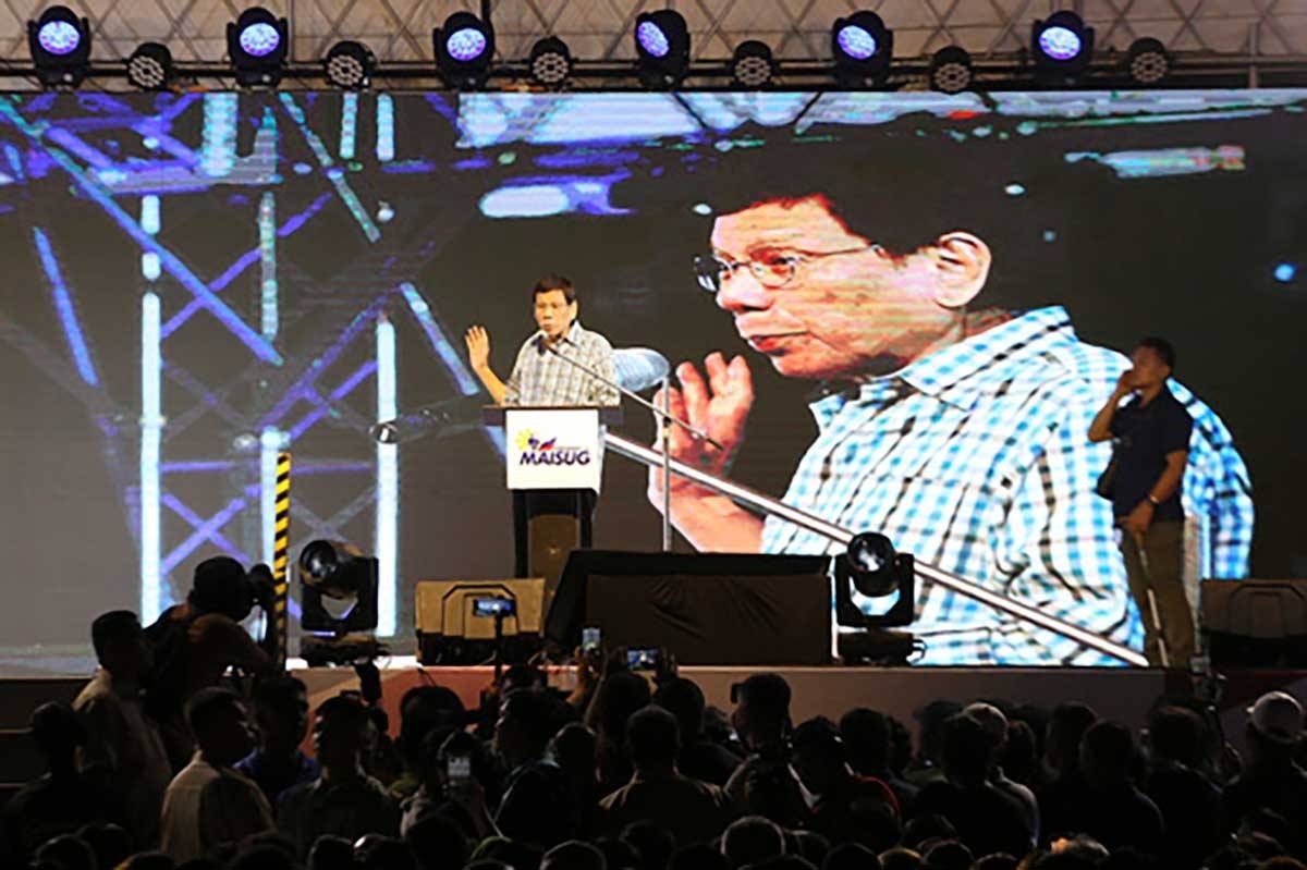 Former Philippine President Rodrigo Duterte gestures during his speech in Davao, southern Philippines late Sunday Jan. 28, 2024. Former President Duterte is throwing allegations at his successor, Fernando Marcos Jr., and even raising the prospect of removing him from office, bringing into the open a long-rumored split between the two. (AP Photo/Manman Dejeto)