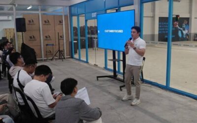READY FOR 2024 Angkas co-founder and chief executive officer George Royeca (right) speaks at a ‘2024 and Beyond’ townhall on Jan. 24, 2024, at their headquarters in Makati City. CONTRIBUTED PHOTO