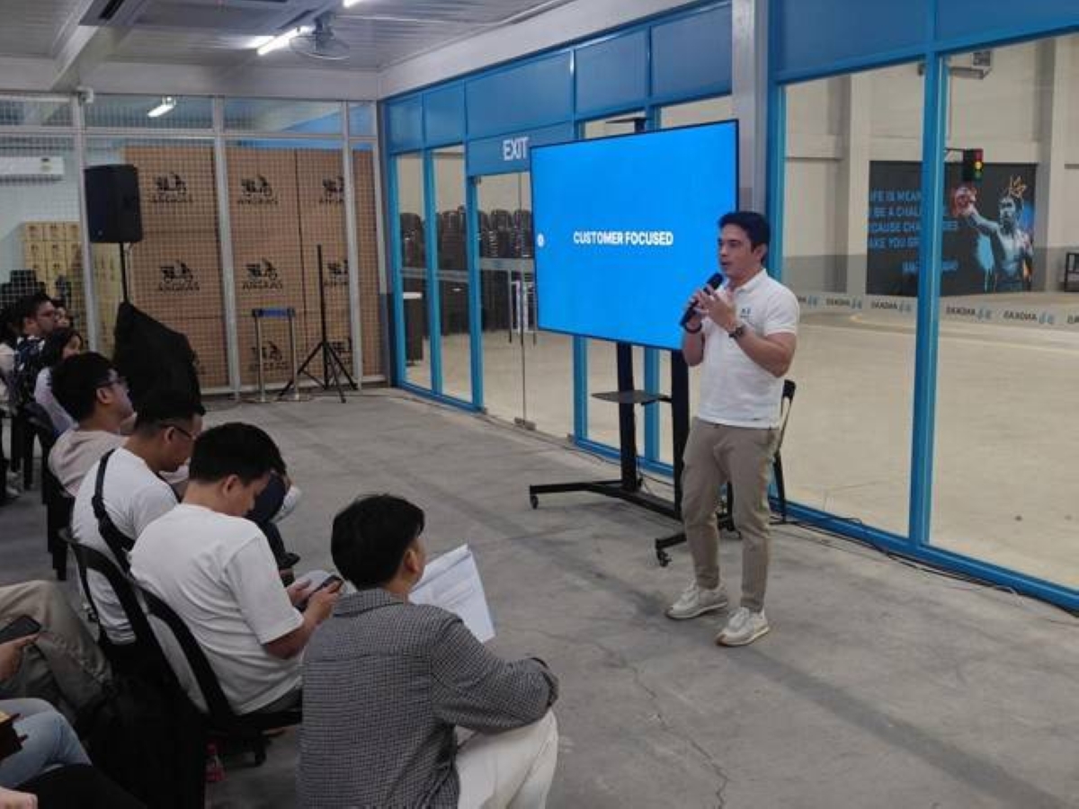 READY FOR 2024 Angkas co-founder and chief executive officer George Royeca (right) speaks at a ‘2024 and Beyond’ townhall on Jan. 24, 2024, at their headquarters in Makati City. CONTRIBUTED PHOTO