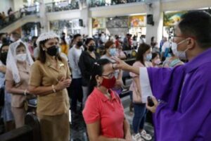 ASH WEDNESDAY. A Catholic priest puts ash on the forehead of an elderly woman during the observance of Ash Wednesday at the St. Peter Parish: Shrine of Leaders in Quezon City in this file photo. Ash Wednesday, which marks the start of the Lenten season, falls on Valentines Day this year. PHILIPPINE NEWS AGENCY PHOTO