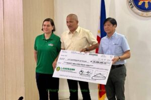 GOVT AID A representative from Davao City receives the P20 million cash assistance from President Ferdinand Marcos Jr. (right) and Vice President Sara Duterte in Davao on Thursday, Feb. 8, 2024 for residents affected by the floods and landslides. PHOTO FROM OVP COMMUNICATIONS