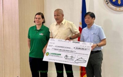 GOVT AID A representative from Davao City receives the P20 million cash assistance from President Ferdinand Marcos Jr. (right) and Vice President Sara Duterte in Davao on Thursday, Feb. 8, 2024 for residents affected by the floods and landslides. PHOTO FROM OVP COMMUNICATIONS