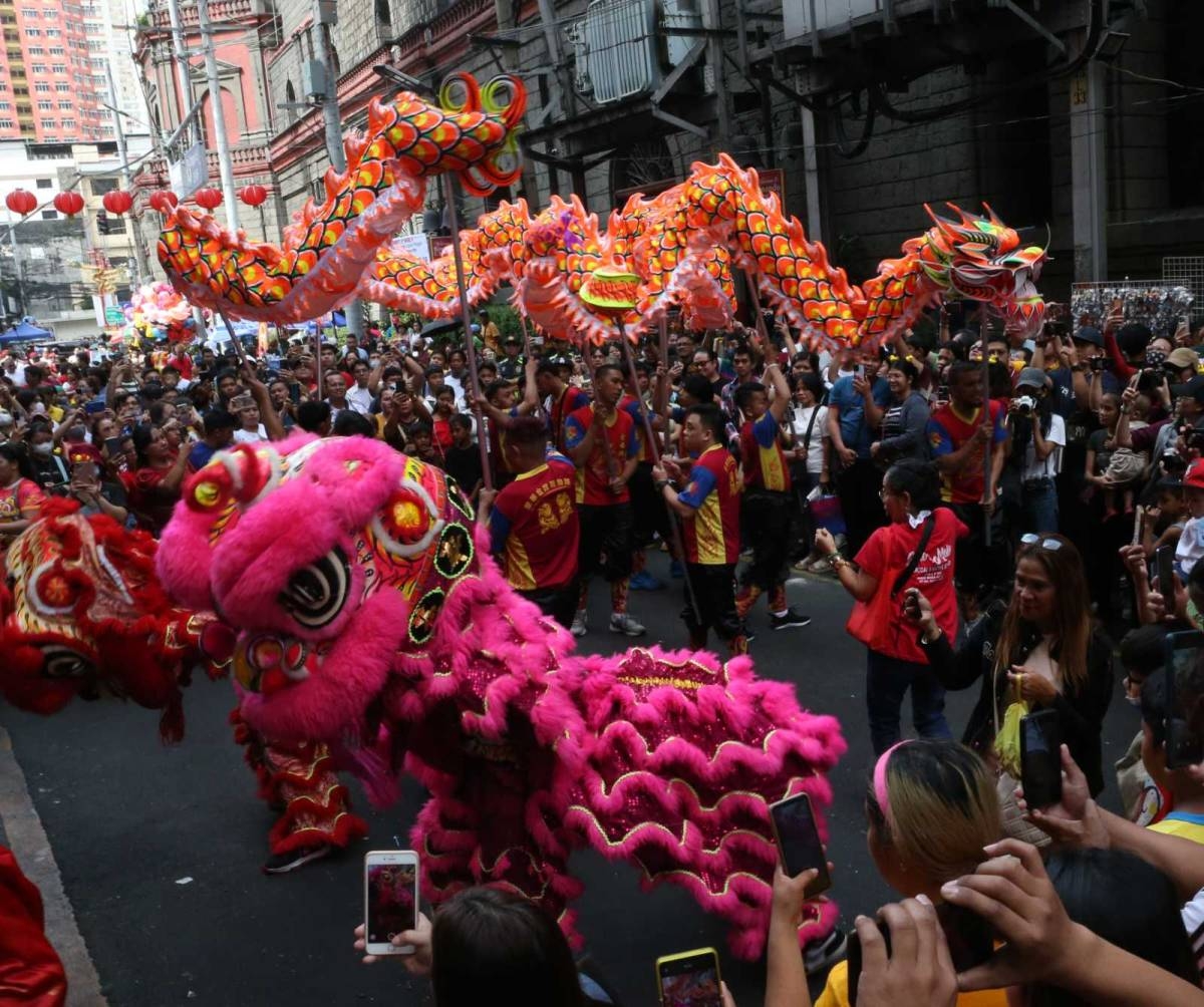 PHOTO BY RENE H. DILAN
CHINESE NEW YEAR-100224-DILAN
Visitors flock to Ongpin St., Binondo, Manila and enjoy watching the performers of the Dragon Dance in celebration of the Chinese New Year on Saturday, February 10, 2024. Binondo, considered as the oldest Chinatown in the world, marks the 430th year anniversary dating back to the Spanish colonial era.
