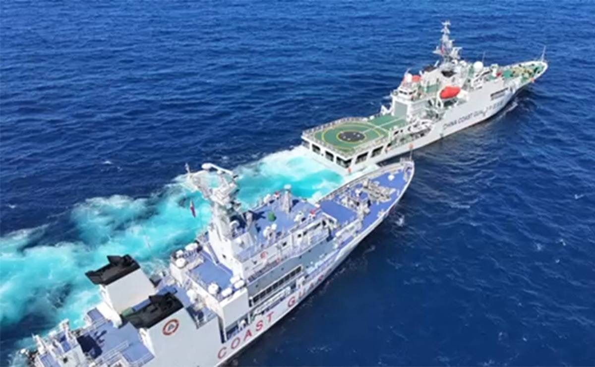 Blocked This frame grab from a handout video taken on Thursday, Feb. 8, 2024, and released by the Philippine Coast Guard on February 11 shows a China Coast Guard vessel (front right) blocking and sailing past BRP Teresa Magbanua near Scarborough Shoal. AFP