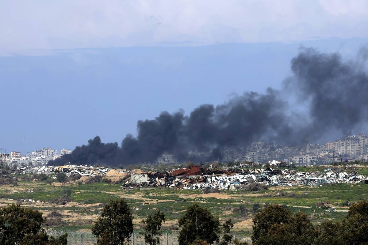 A picture taken from a position in southern Israel on February 16, 2024 shows smoke billowing following Israeli bombardment on the Gaza Strip, amid ongoing battles between Israel and the Palestinian militant group Hamas. (Photo by JACK GUEZ / AFP)