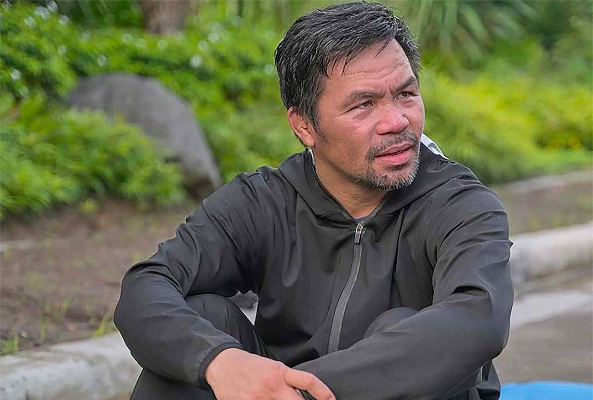 Manny Pacquiao sitting after workout