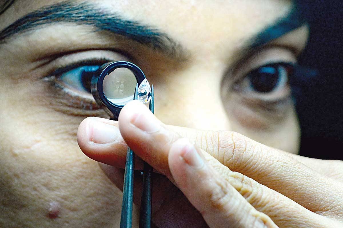 Same sparkle This photograph, taken on Feb. 6, 2024, shows employees working at Greenlab Diamonds, a firm manufacturing lab-grown gems on the outskirts of Surat. Man-made gems are reshaping the $89 billion global diamond jewelry market, especially in the west Indian city of Surat, where 90 percent of the world’s diamonds are cut and polished. AFP PHOTO