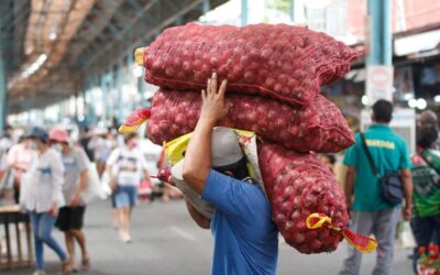 Workers unload sacks of Red onions as they delivered it to stores inside the Marikina public market. Photo by John Orven Verdote