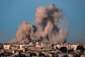 This picture taken from Rafah in the southern Gaza Strip shows smoke billowing during Israeli bombardment on Khan Yunis on February 22, 2024, amid continuing battles between Israel and the Palestinian militant group Hamas. (Photo by SAID KHATIB / AFP)