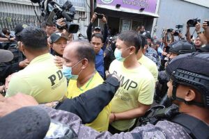 JUDGMENT DAY Policemen accused in the killing of Jemboy Garcia,17, are escorted outside the Navotas Regional Trial Court on Tuesday, Feb. 27, 2024. Only one policeman was convicted. PHOTO BY RENE H. DILAN