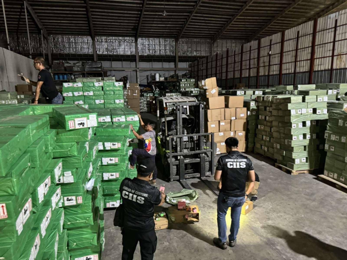 SEIZED VAPES Intelligence agents of the Bureau of Customs inspect one of the Malabon warehouses that yielded illegal imported e-cigarettes or vapes from China on Friday, March 1, 2024. CONTRIBUTED PHOTO