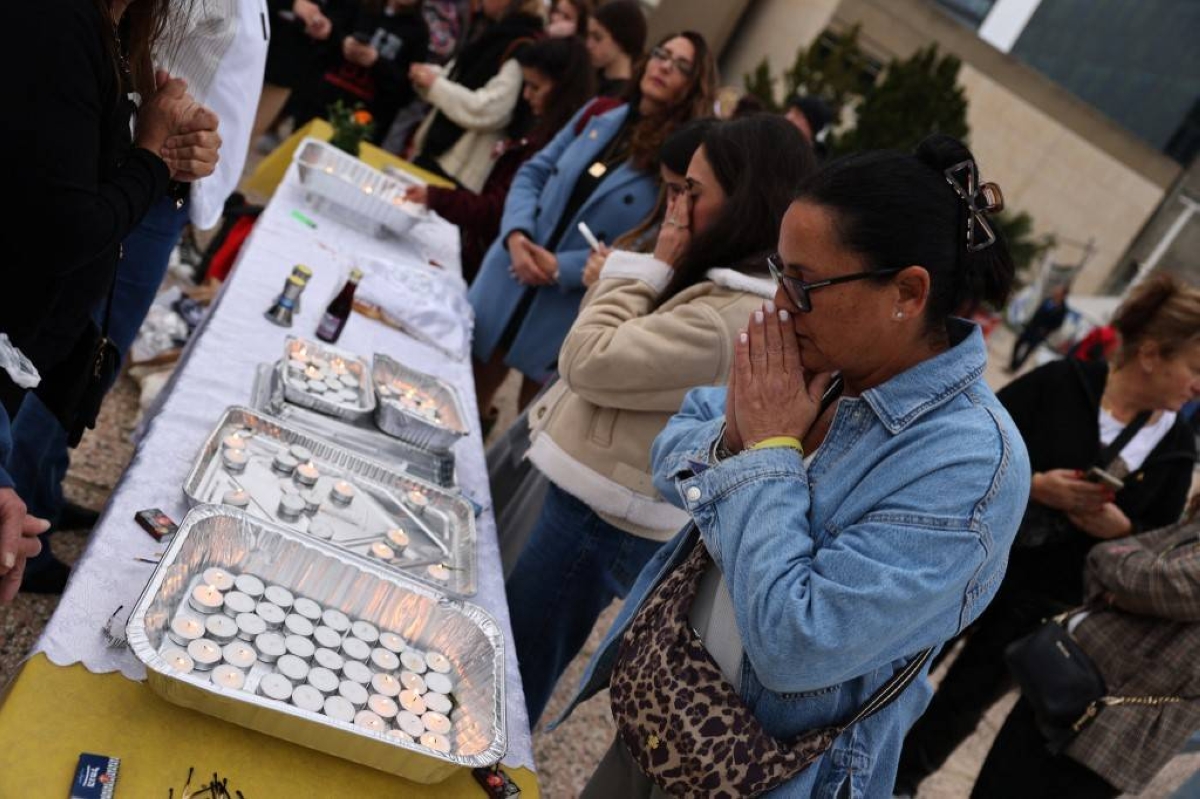 HOPE FLICKERING Supporters and families of Israeli hostages held in Gaza since the October 7 attacks light candles as they set up a symbolic Shabbat dinner table during a protest calling for their return in the western city of Tel Aviv on Friday, Feb. 23, 2024. AFP PHOTO
