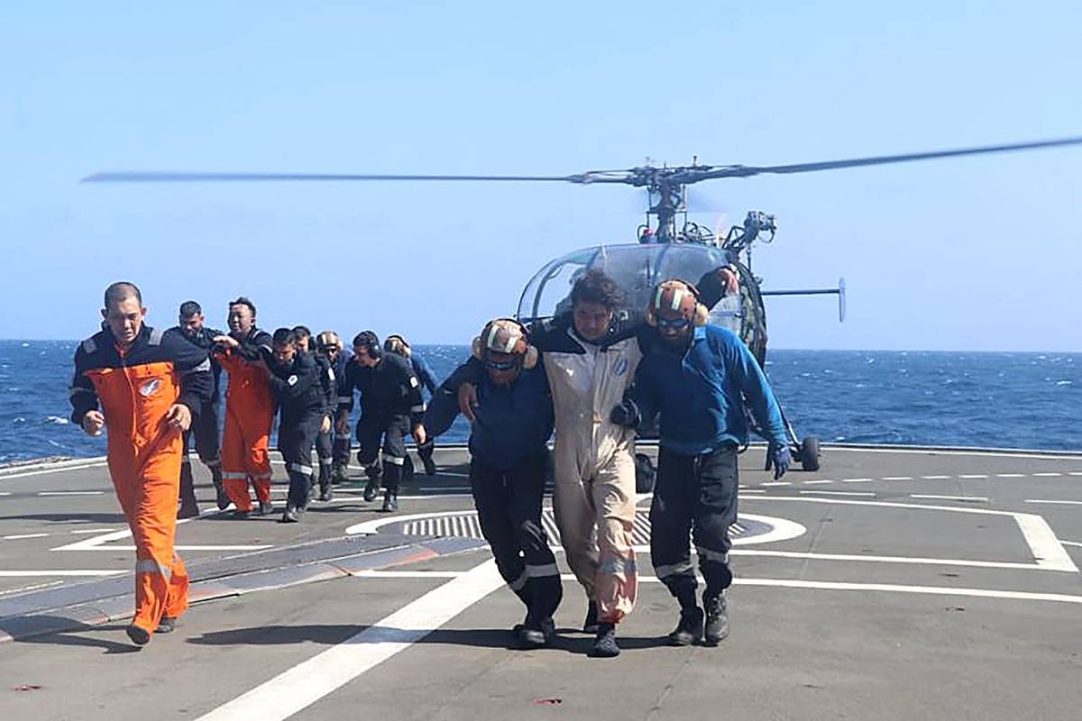 RESCUE 
This handout photograph taken on Wednesday, March 6, 2024, and released by the Indian Navy shows the rescue operation of crew members of a Barbados-flagged bulk carrier by the Indian Navy after an attack by Yemen’s Houthi rebels. AFP PHOTO