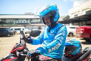 An Angkas rider checks his schedule. CONTRIBUTED PHOTO