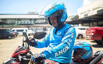 An Angkas rider checks his schedule. CONTRIBUTED PHOTO
