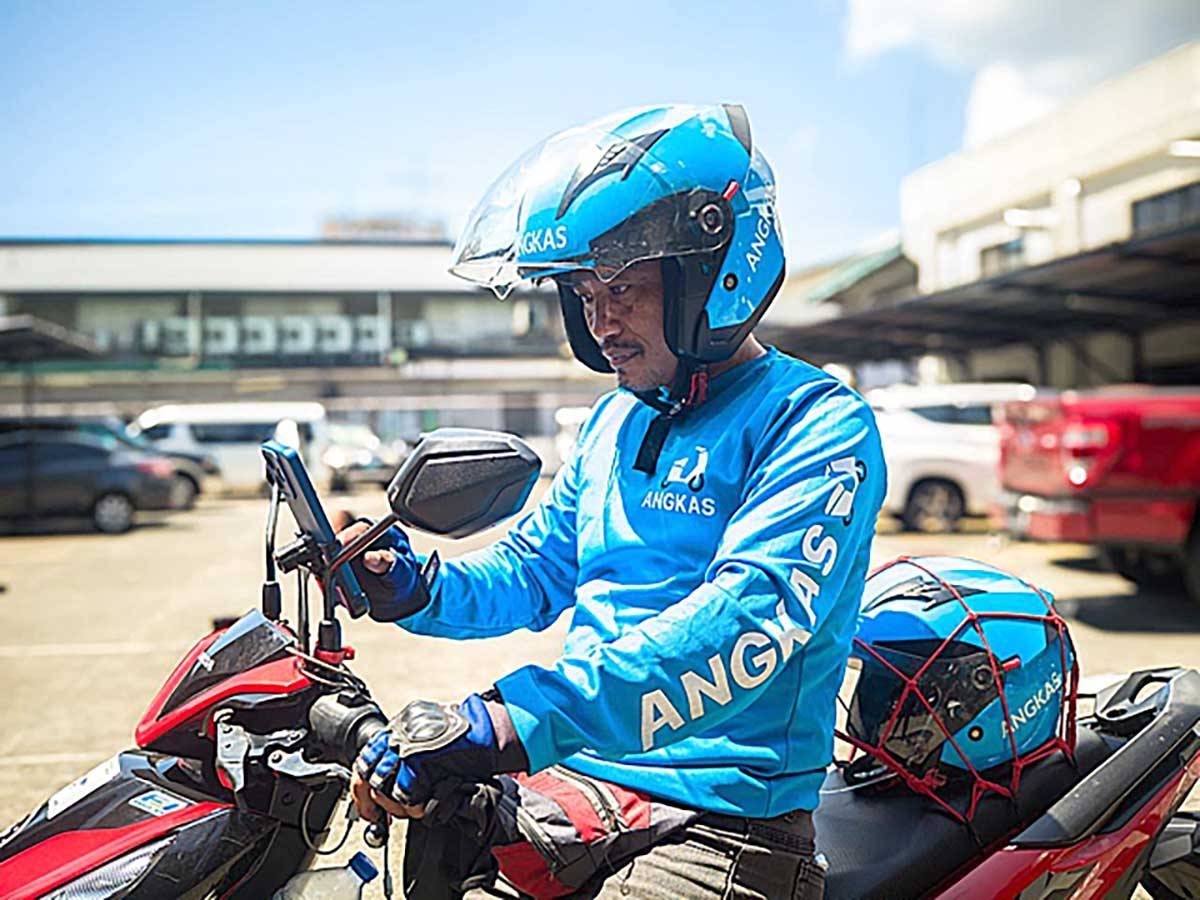 An Angkas rider checks his schedule. CONTRIBUTED PHOTO