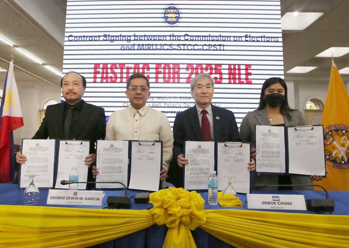IT’S A DEAL Commission on Elections Chairman Erwin Garcia (second from left), Miru Systems President Jinbok Chung, Commissioner Rey Bulay and Miru’s Valerie Ann Manahan hold copies of the signed contract on Monday, March 11, 2024. Photo by Rene H. Dilan